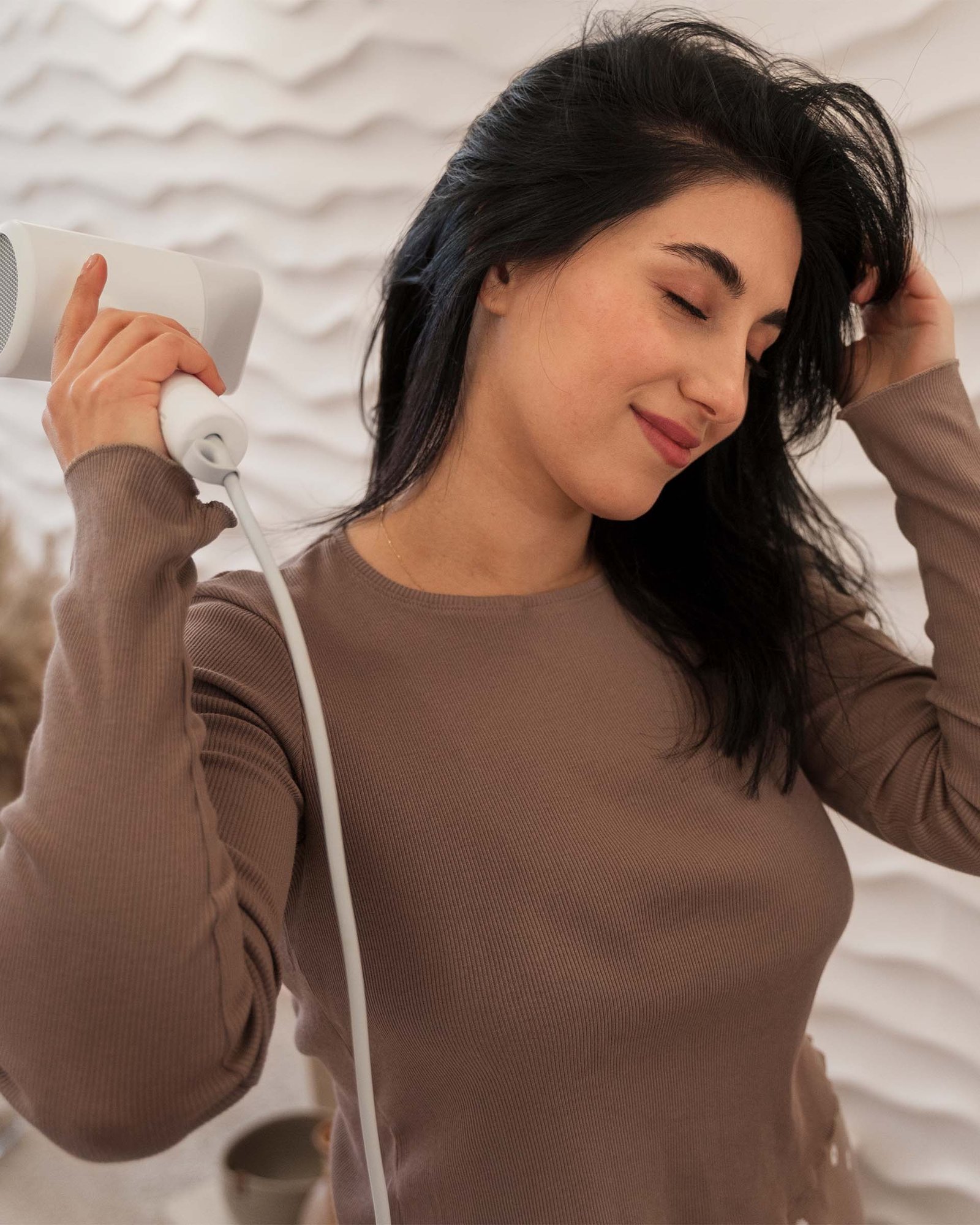 women hand on hair dryer - Hair Care